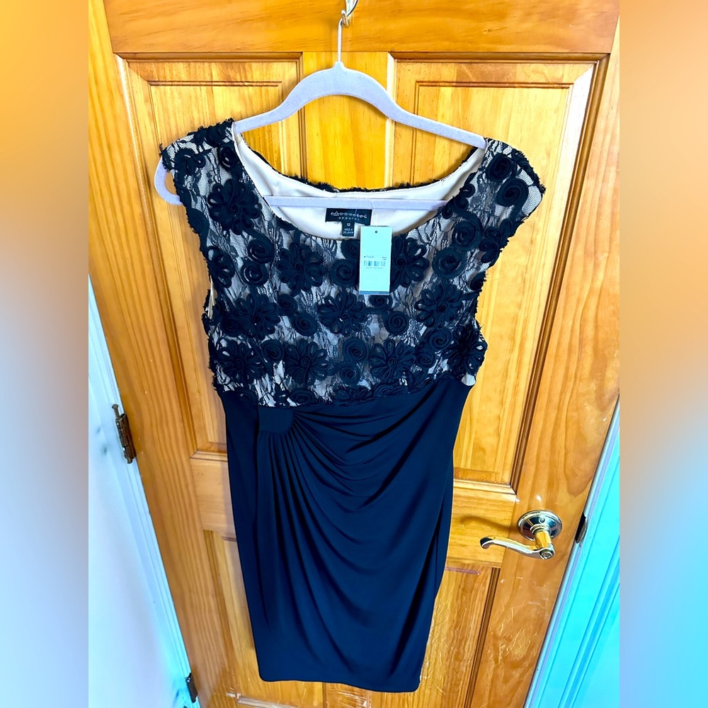 Brand new black dress. Size 12.